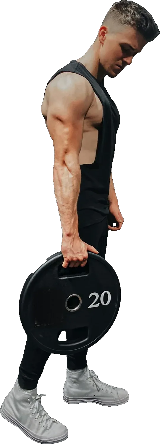 Athlet trägt eine 20-Kilo-Hantelscheibe